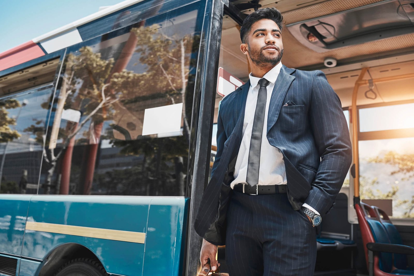 corporate businessman travel in a city on a bus to 2026 01 09 10 54 41 utc
